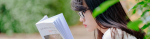 Asian woman reading a book